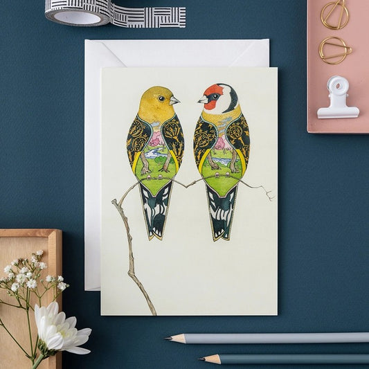 Artistic card of two birds with intricate designs on a branch.