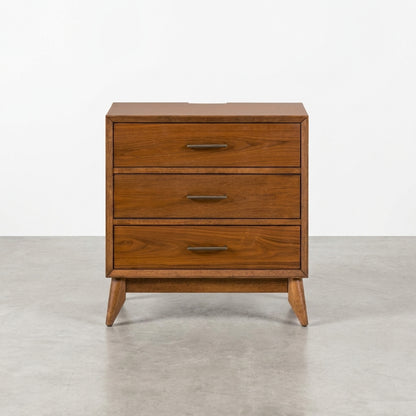Wooden dresser with three drawers and simple metal handles.