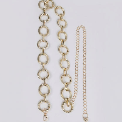 Two different gold chain styles on a white background.