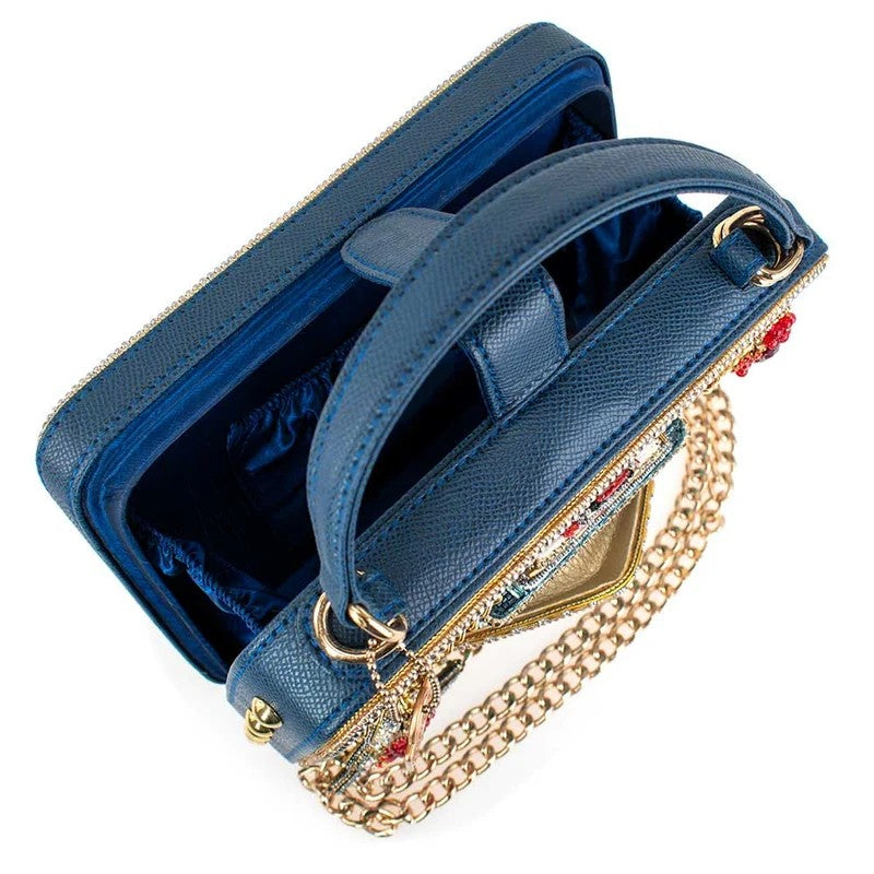 Blue handbag with a top handle, gold chain, and colorful beaded accents.