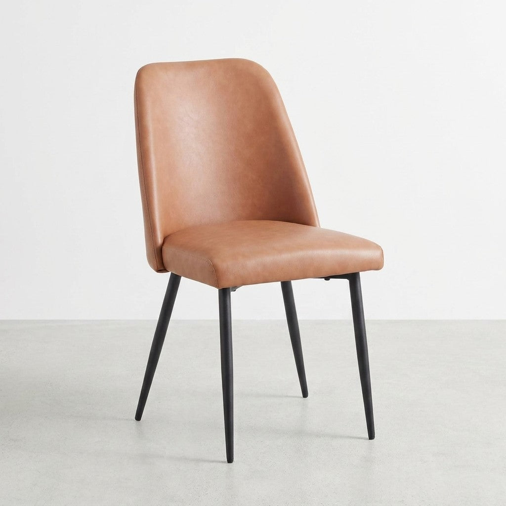 Brown leather chair with sleek black legs.