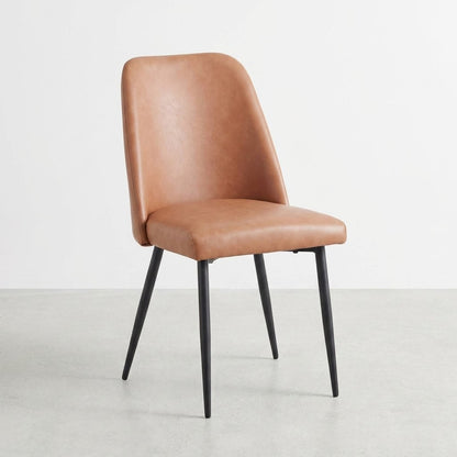 Brown leather chair with sleek black legs.