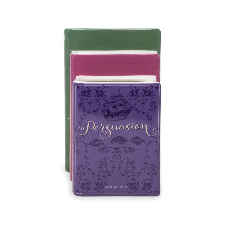 Three colorful book-shaped tins, with "Persuasion" on the front one.