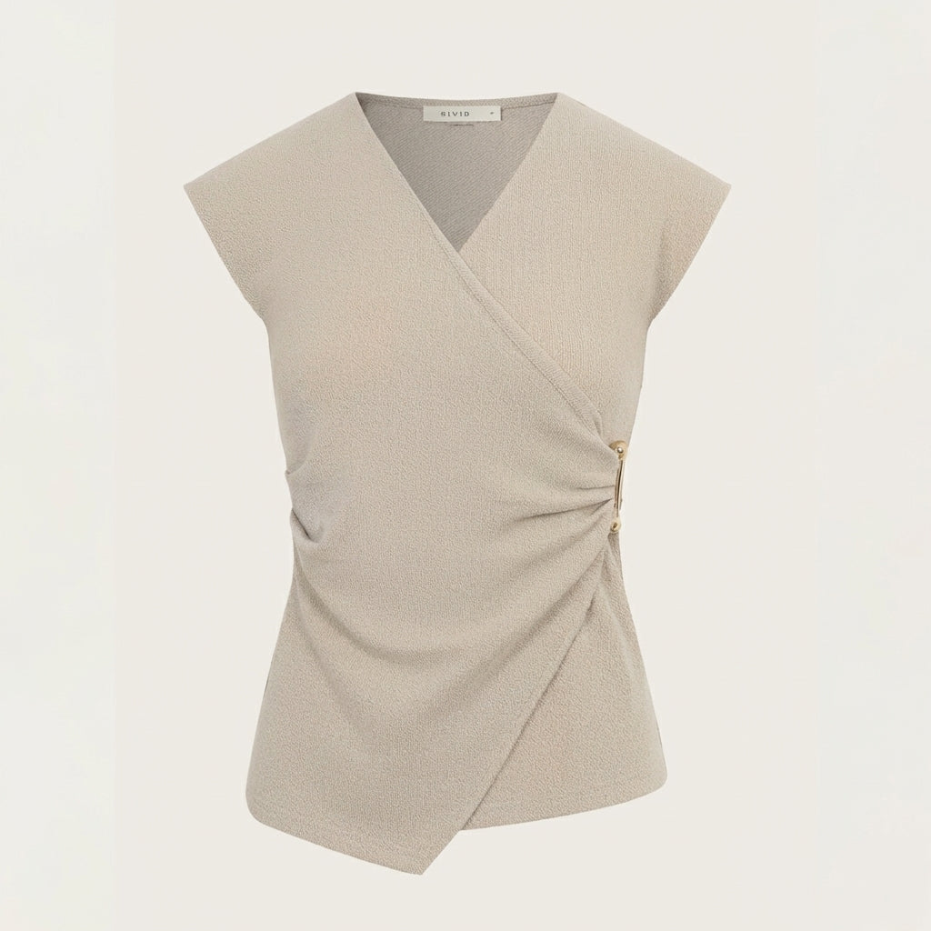 Beige wrap top with cap sleeves and two side buttons.