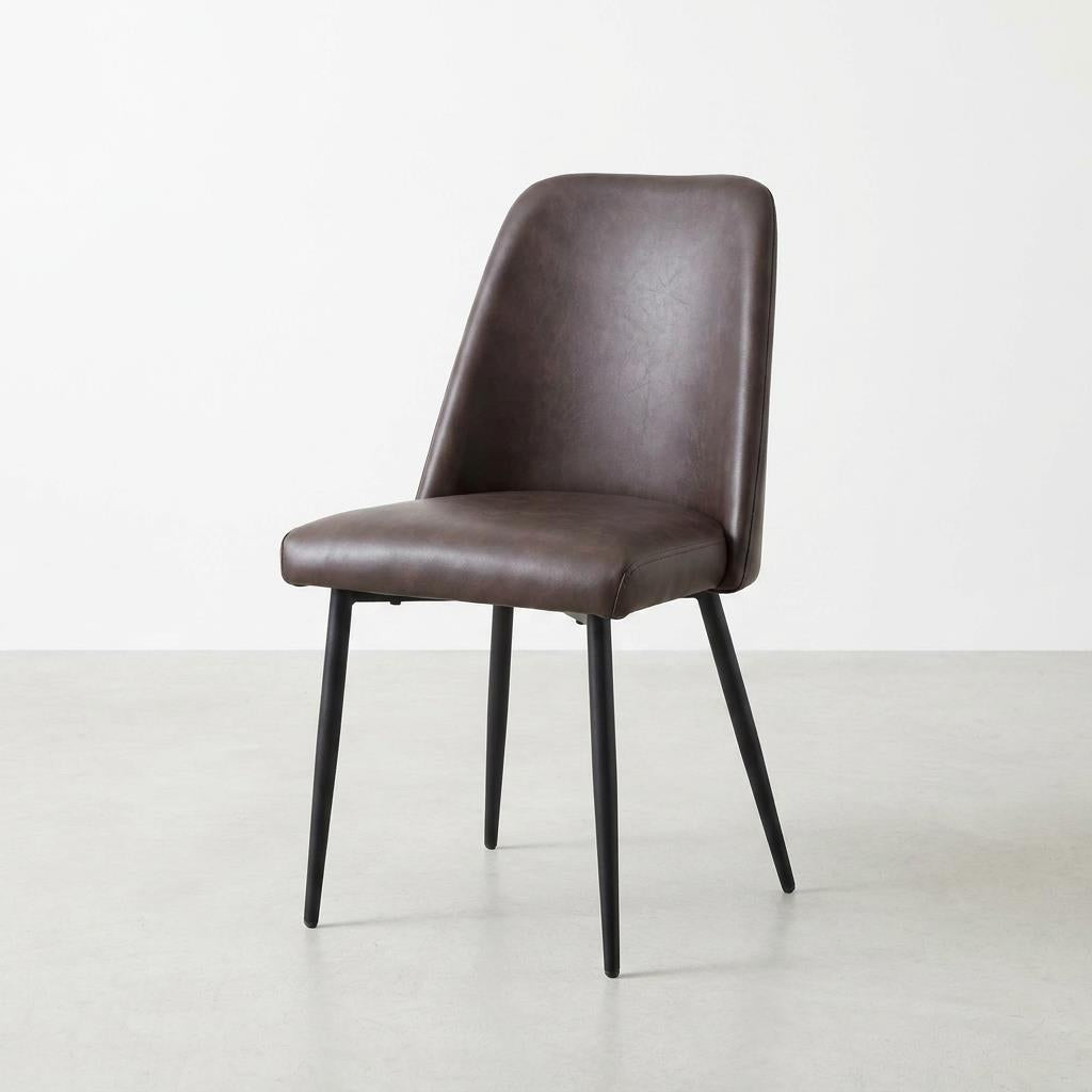 Modern brown chair with black metal legs.