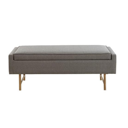 Gray upholstered bench with gold legs.