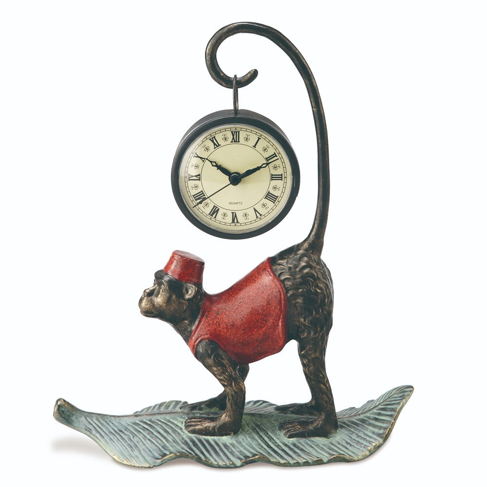 Monkey figurine holding a clock with curled tail on a leaf base.