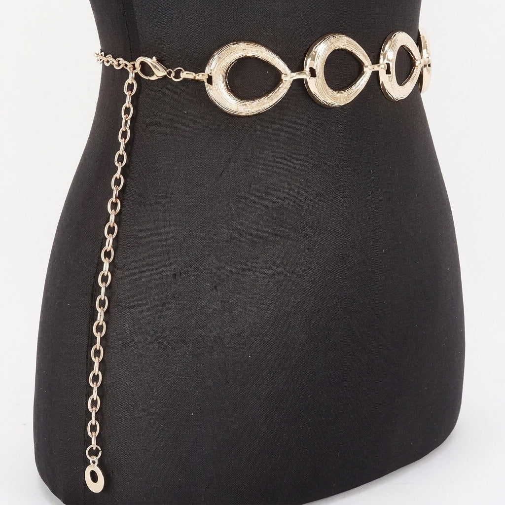 Gold chain belt with circular links on a black mannequin.