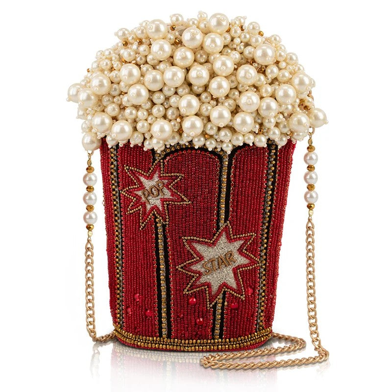 Popcorn-shaped beaded purse with pearl detailing and star patterns.