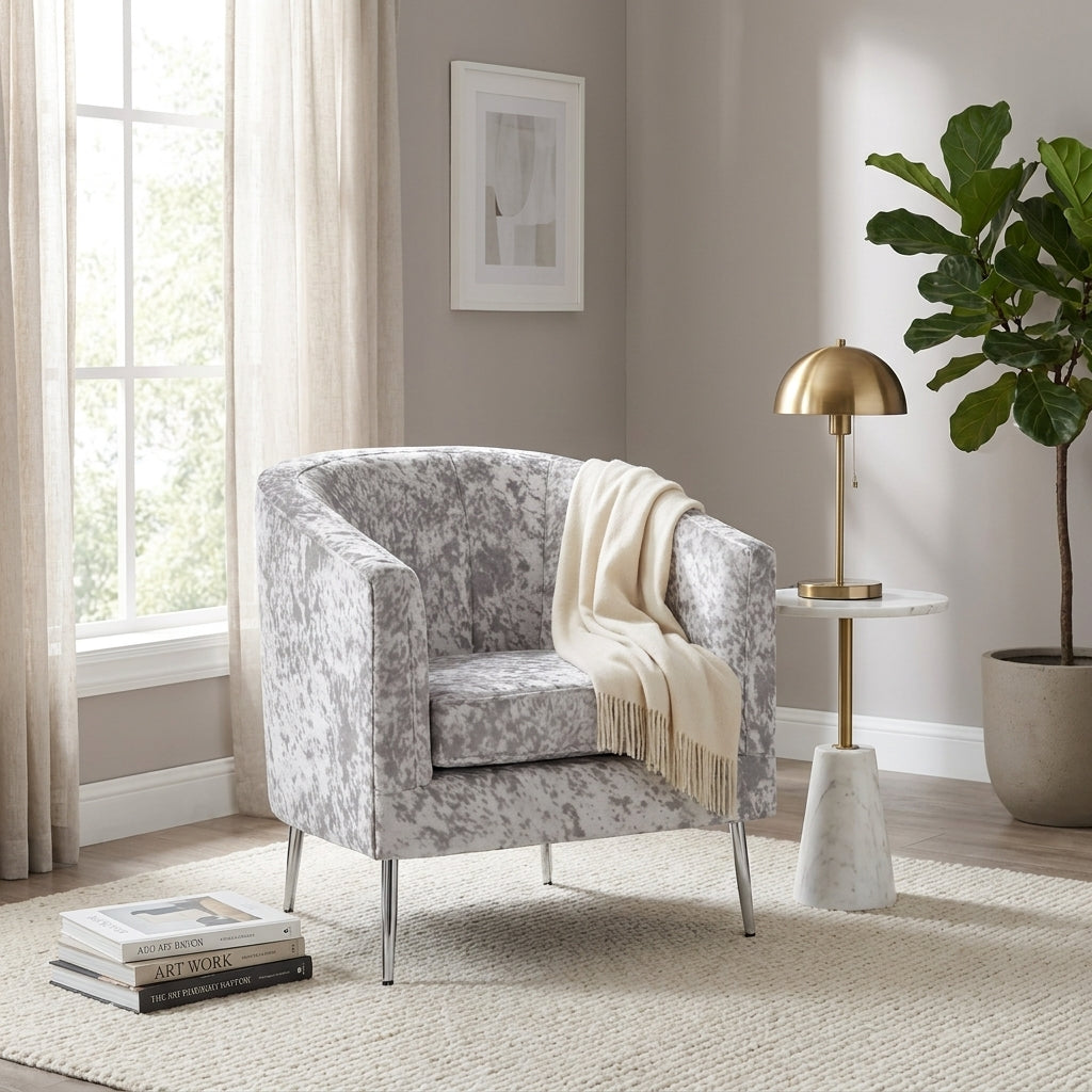 Gray speckled armchair with metal legs.