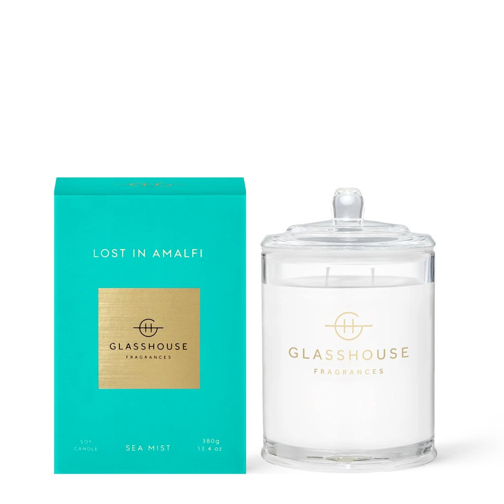 Teal box and clear candle jar, "Lost in Amalfi" scent, elegant design.