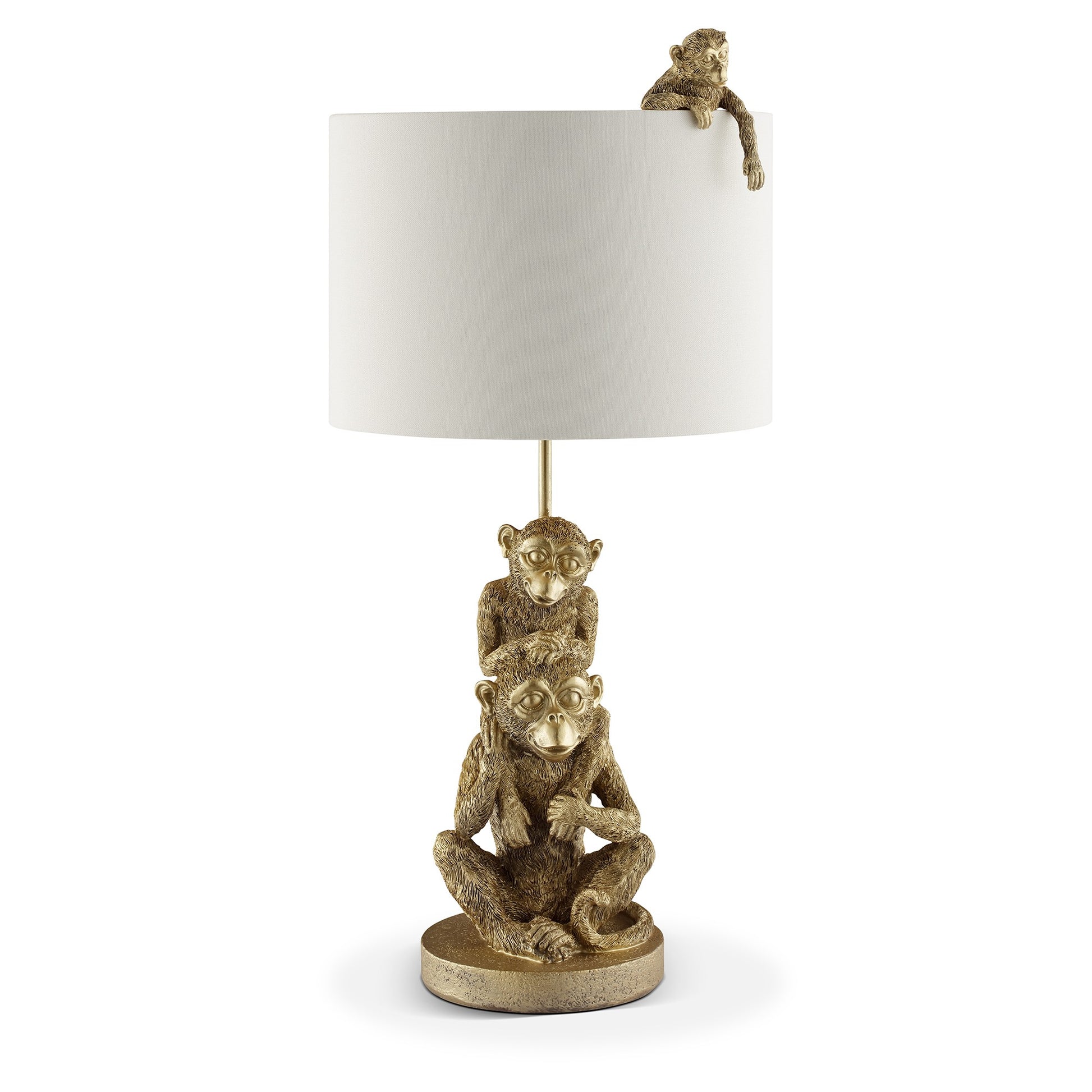 Gold monkey lamp with white shade and monkey accents.