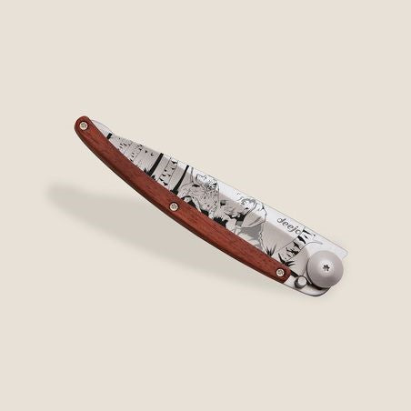 Folding knife with a wooden handle and detailed blade artwork.