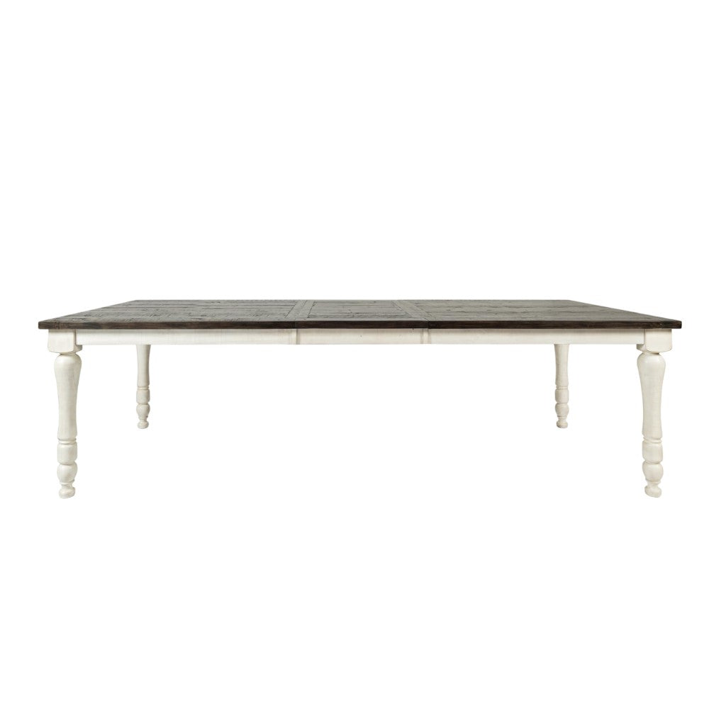 Wooden dining table with dark top and white legs.