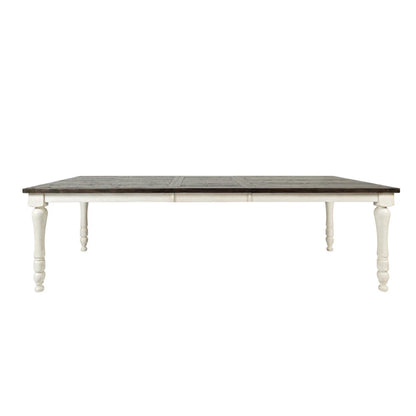 Wooden dining table with dark top and white legs.