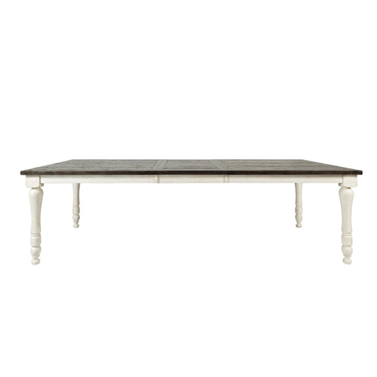 Wooden dining table with dark top and white legs.