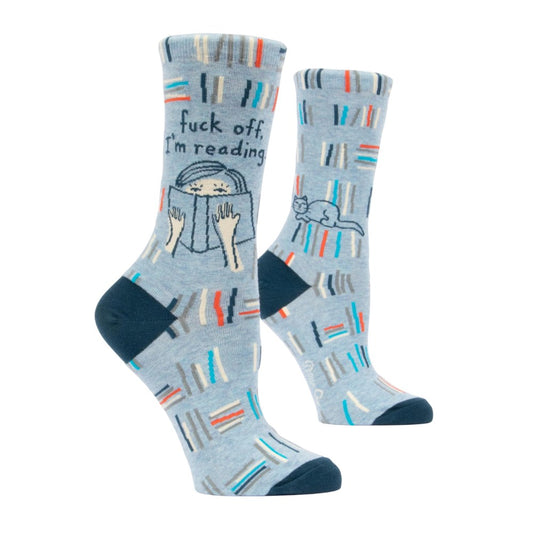 Blue socks with books, reading figure, and playful phrases.