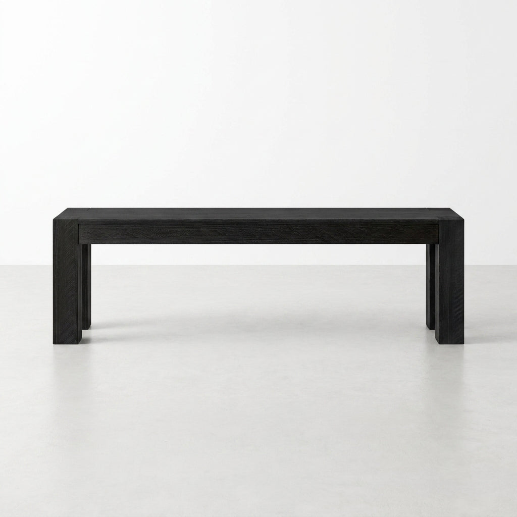 Simple black rectangular bench on a light floor.