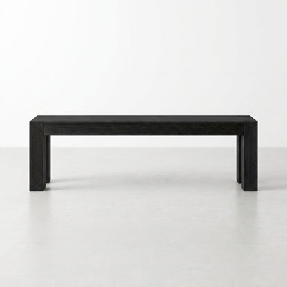 Simple black rectangular bench on a light floor.