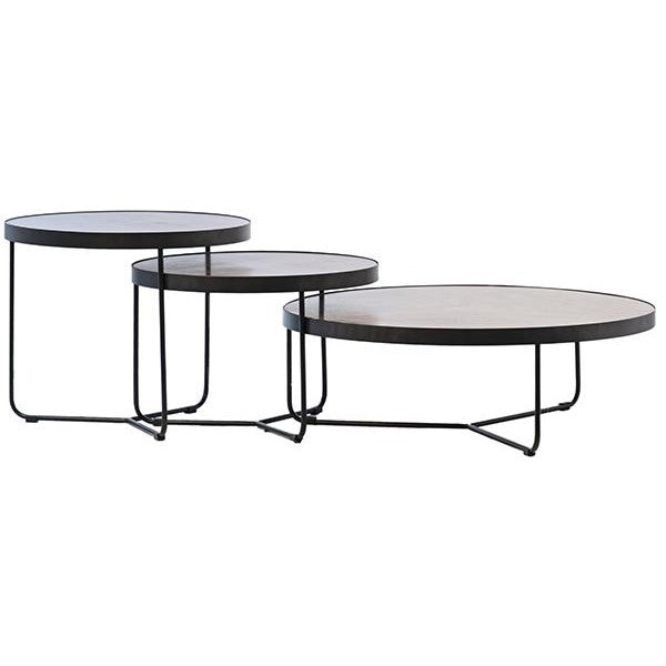 Three stacked round tables with metal legs in different heights.