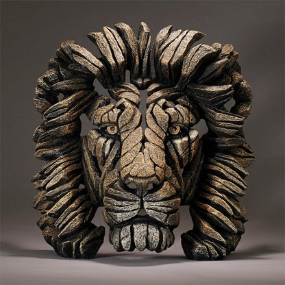 Sculpted lion face made from jagged, textured stone pieces.