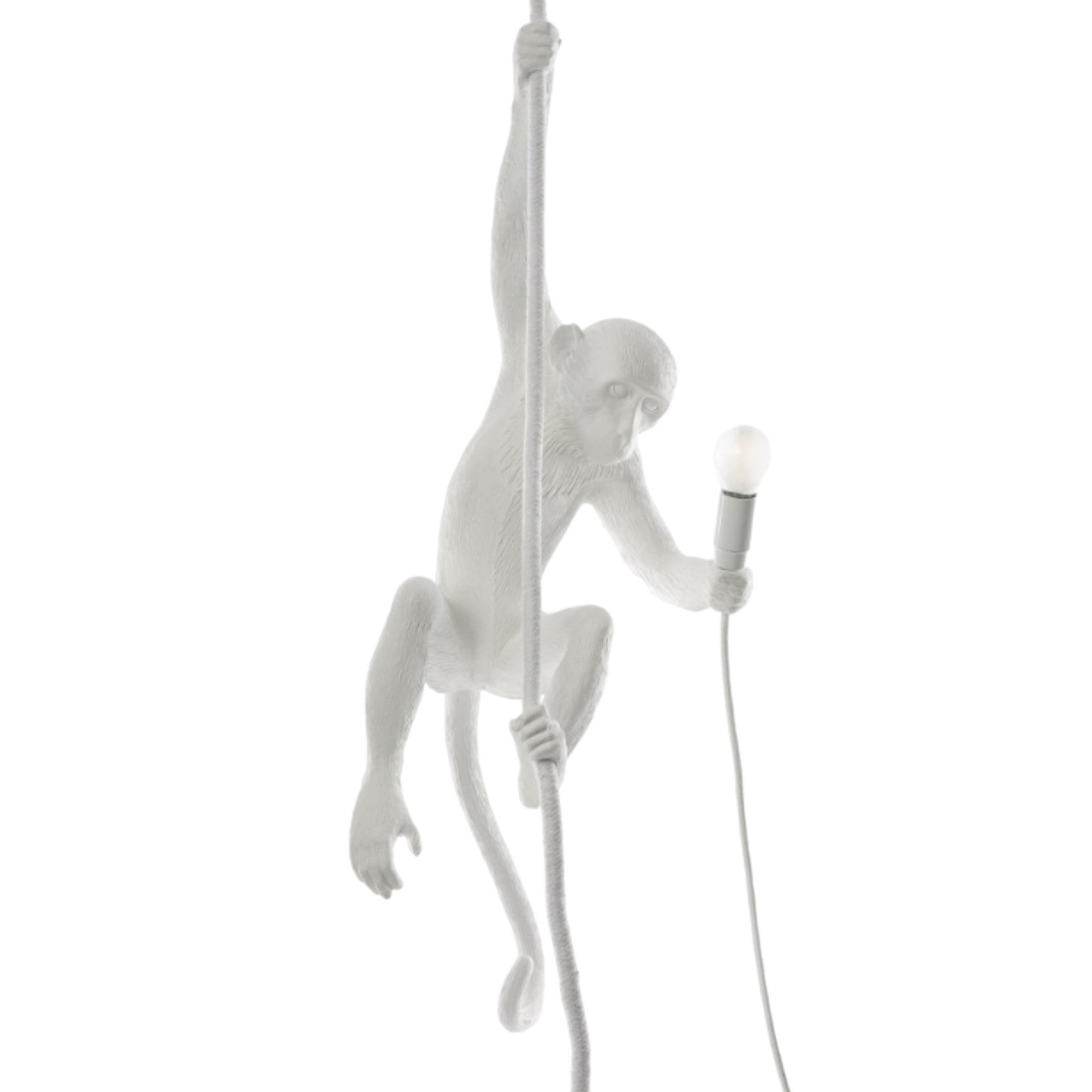 White monkey lamp holding a bulb while climbing a rope.