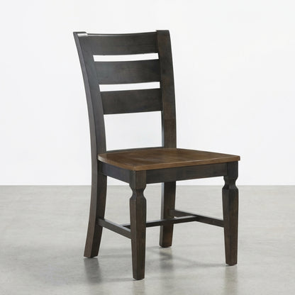Dark wooden chair with ladder back design.