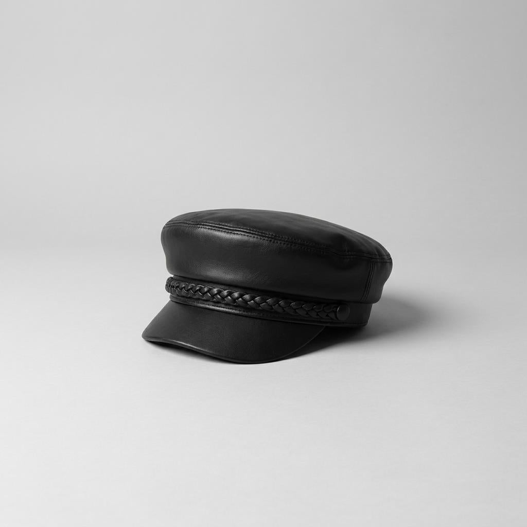 Black leather cap with braided band on a plain background.