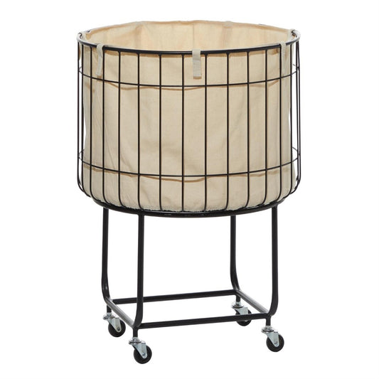 Black wire laundry basket on wheels with a beige fabric liner.