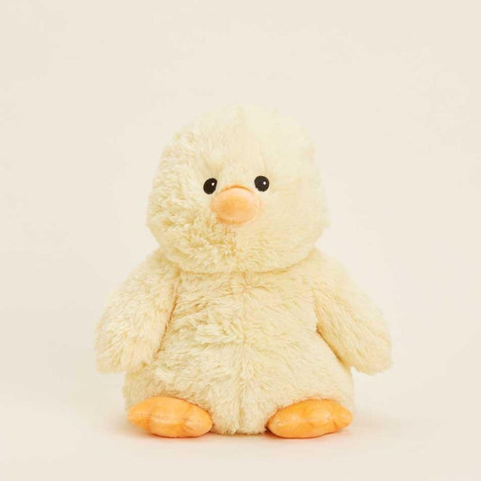 Fluffy yellow duck plush toy on a light background.