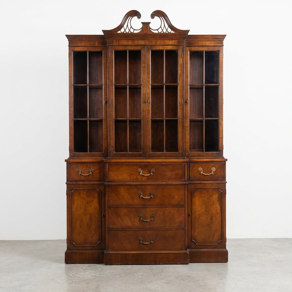 Elegant vintage wooden cabinet with glass doors and drawers.