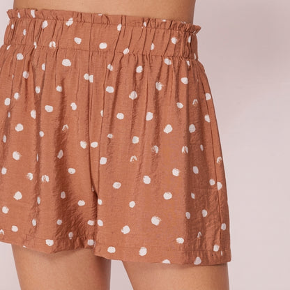 Brown polka dot shorts with elastic waist.