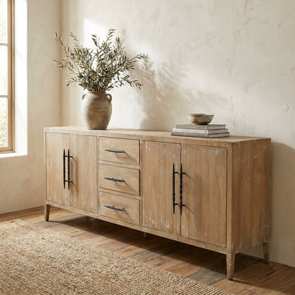 Rustic wooden sideboard with vase and books.