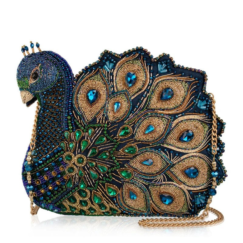 Bejeweled peacock-shaped clutch with intricate embroidery and crystal accents.