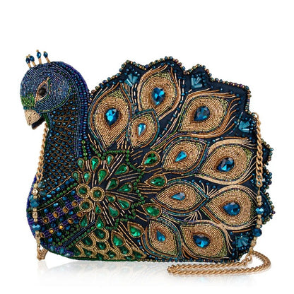 Bejeweled peacock-shaped clutch with intricate embroidery and crystal accents.