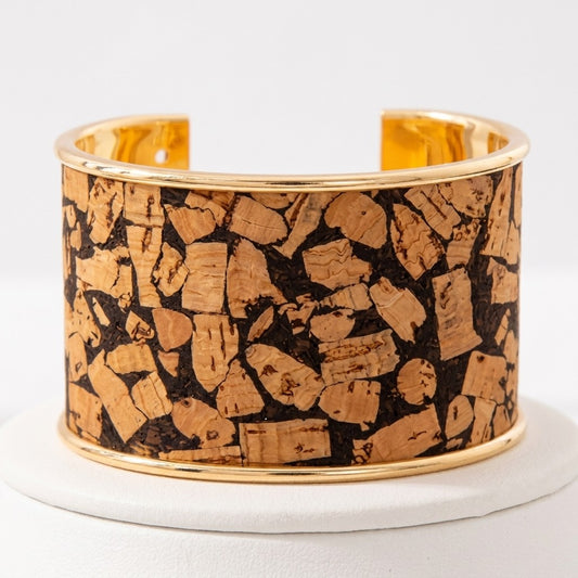 Gold-edged cork-textured bracelet on a white display.