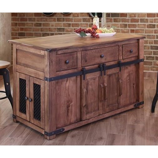Rustic wooden kitchen island with drawers and sliding doors, topped with fruit and plates.