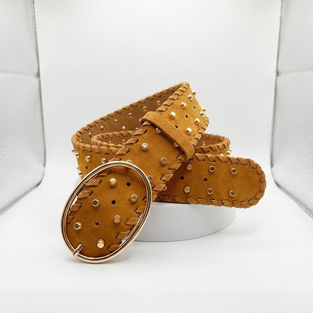 Brown studded leather belt with oval buckle on display.