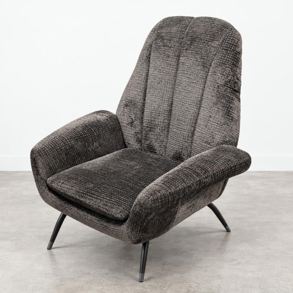 A dark gray upholstered armchair with a tall back and slim black legs.