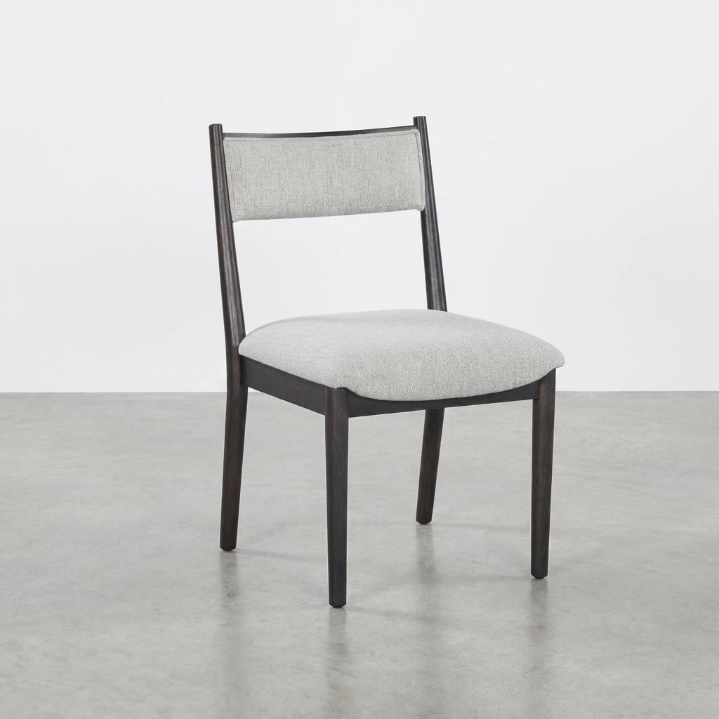 Modern chair with grey cushion and dark wooden frame.