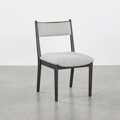 Modern chair with grey cushion and dark wooden frame.