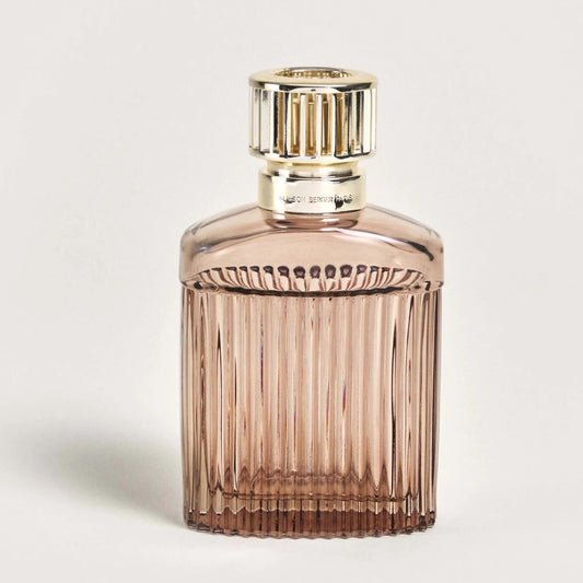 Elegant glass perfume bottle with a golden cap.