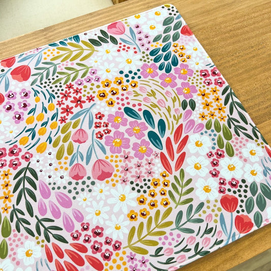 Colorful floral pattern on a wooden surface.
