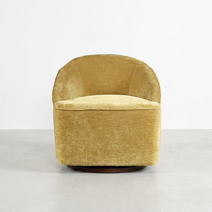 Tan swivel chair with a modern design, viewed from the back.