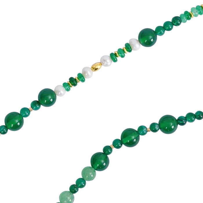 Green bead necklace with pearls and gold accents.