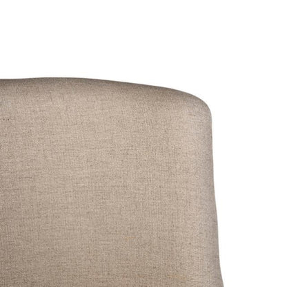 Beige upholstered chair back, minimal design.