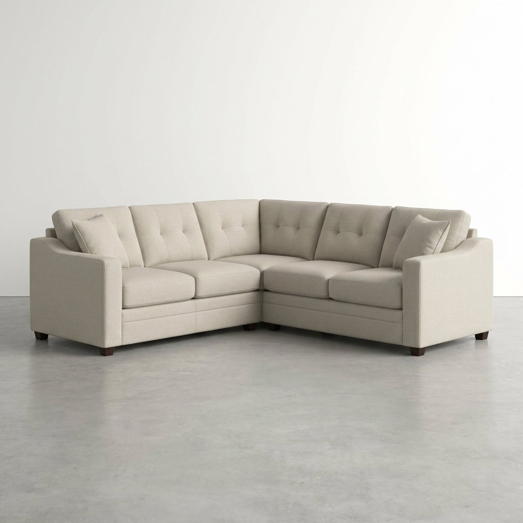 Beige sectional sofa with a wooden coffee table and potted plant in a cozy living room.