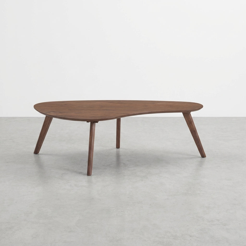 Wooden coffee table with unique asymmetrical design and four angled legs.