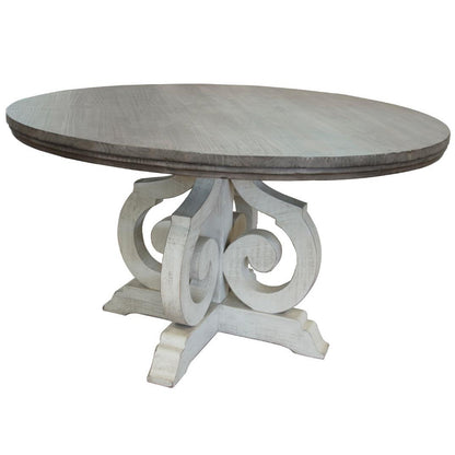 Round table with ornate, scrollwork pedestal base.