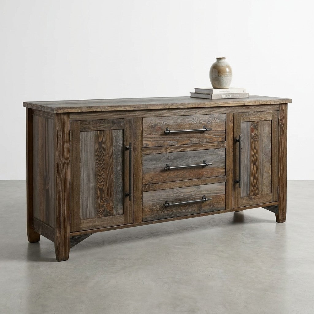 Wooden sideboard with three drawers, two cabinets, books, and a vase on top.